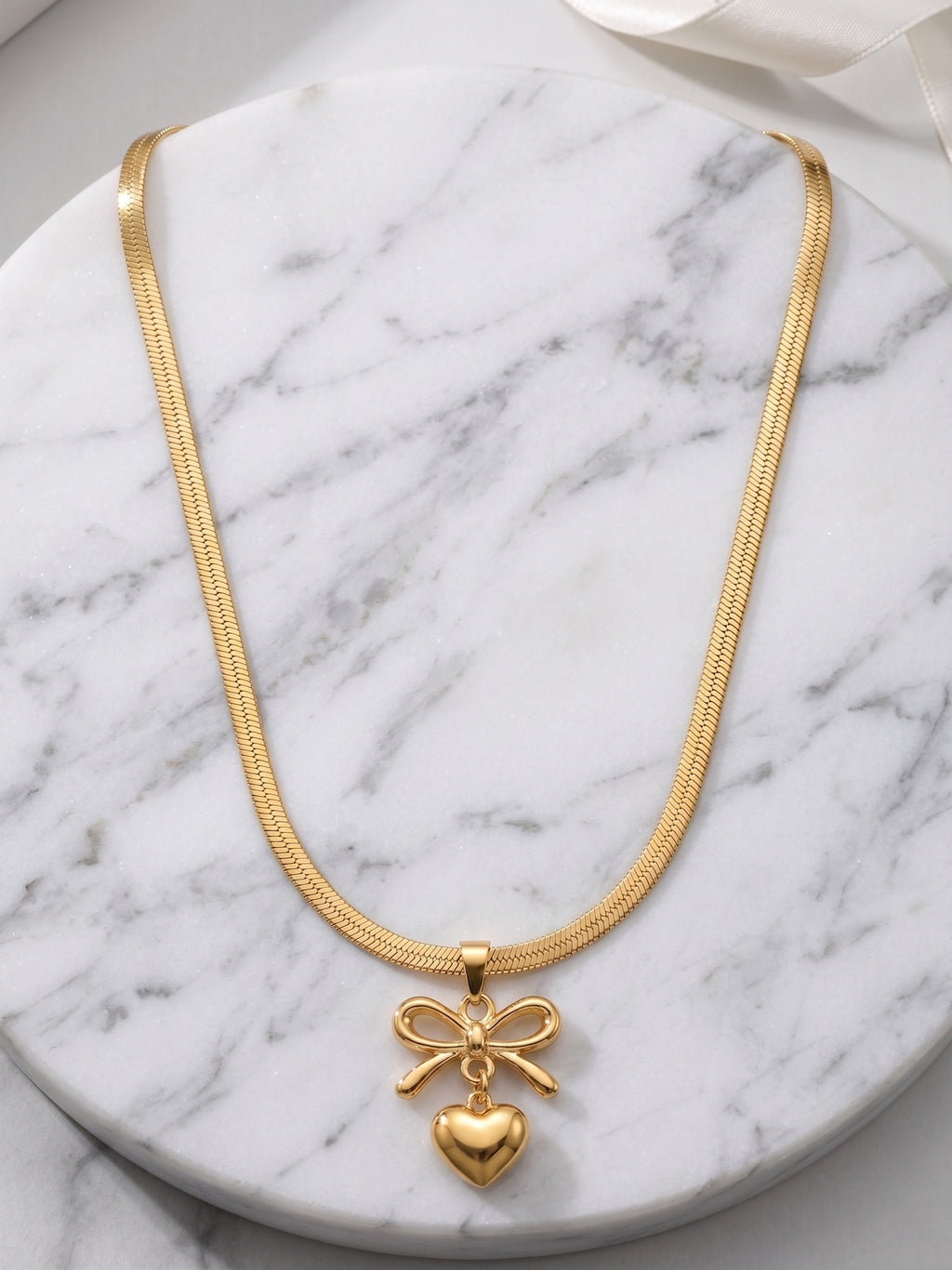 The Juliette Bow & Puffed Heart Herringbone Necklace